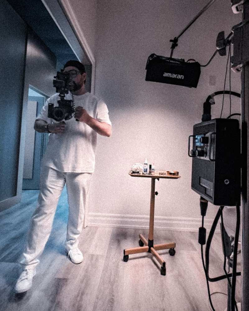 Shahab Balamchi with a cinema camera in a clinic treatment corridor